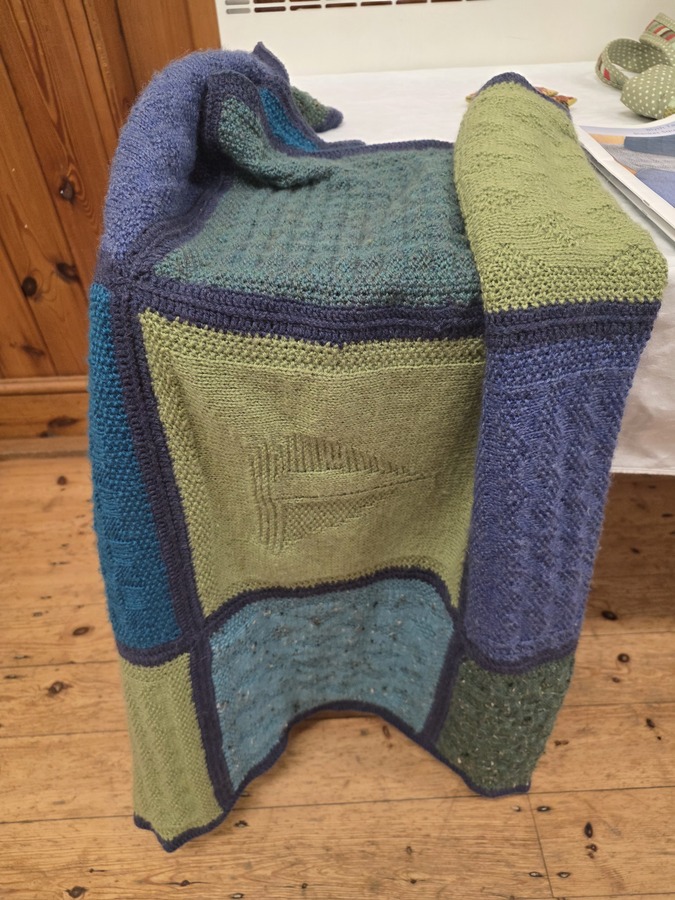 Barbara R - our new member has produced a blanket based on guernsey fisherman's patterns